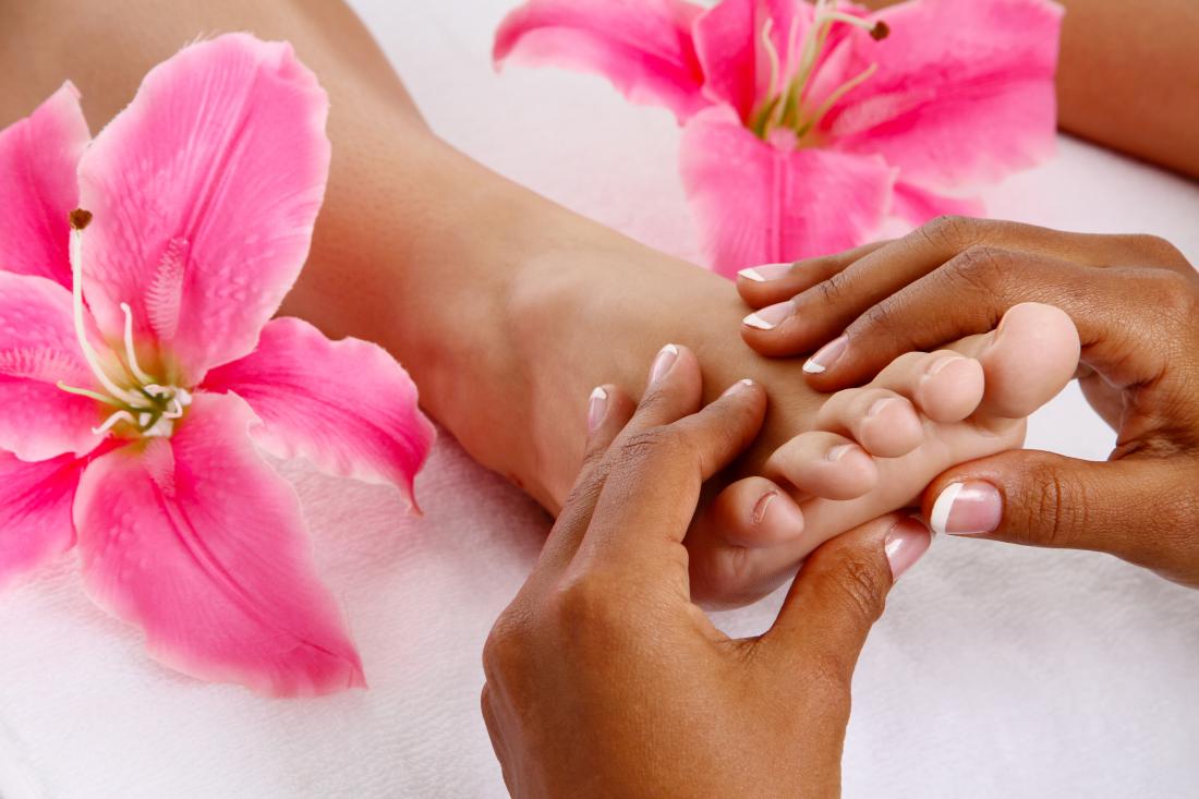 Woman getting a getting relaxing massage in salon